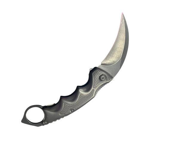 Folding knife with a metallic blade and handle on a white background